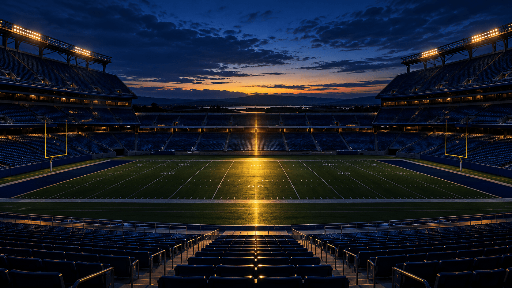 An empty football stadium at blue hour, crossed at midfield by a narrow gold beam of light.